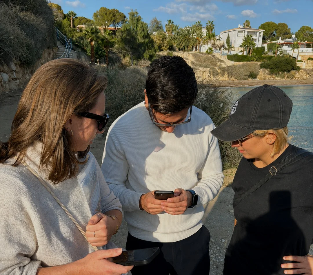 Friends checking the XploreMe app together